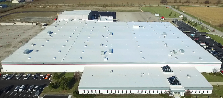  Aerial view of a data center with a newly installed roofing system