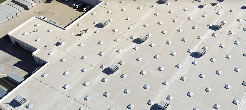 Aerial view of a self-storage complex with new roofing