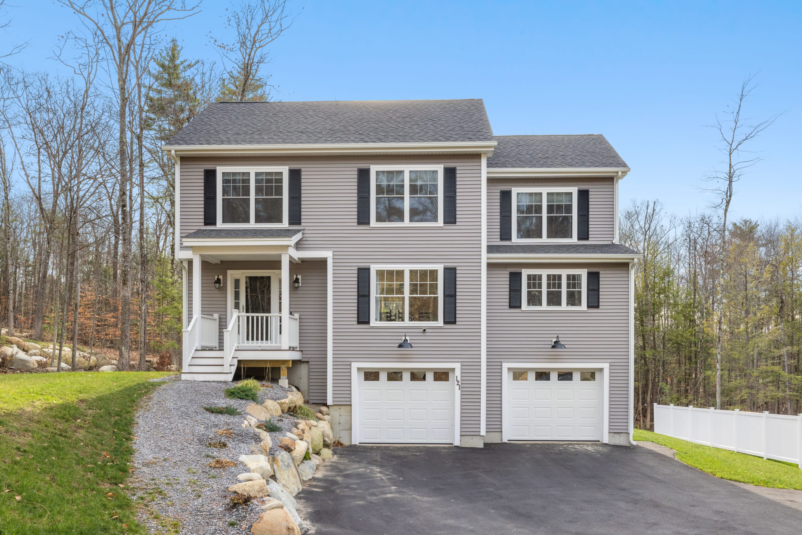 Building of contemporary colonial in an estate. Close-up of freshly installed siding on a Monticello house