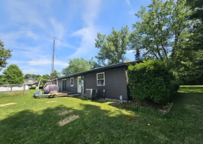 Completed dark siding installation on a property in Bringhurst, Indiana